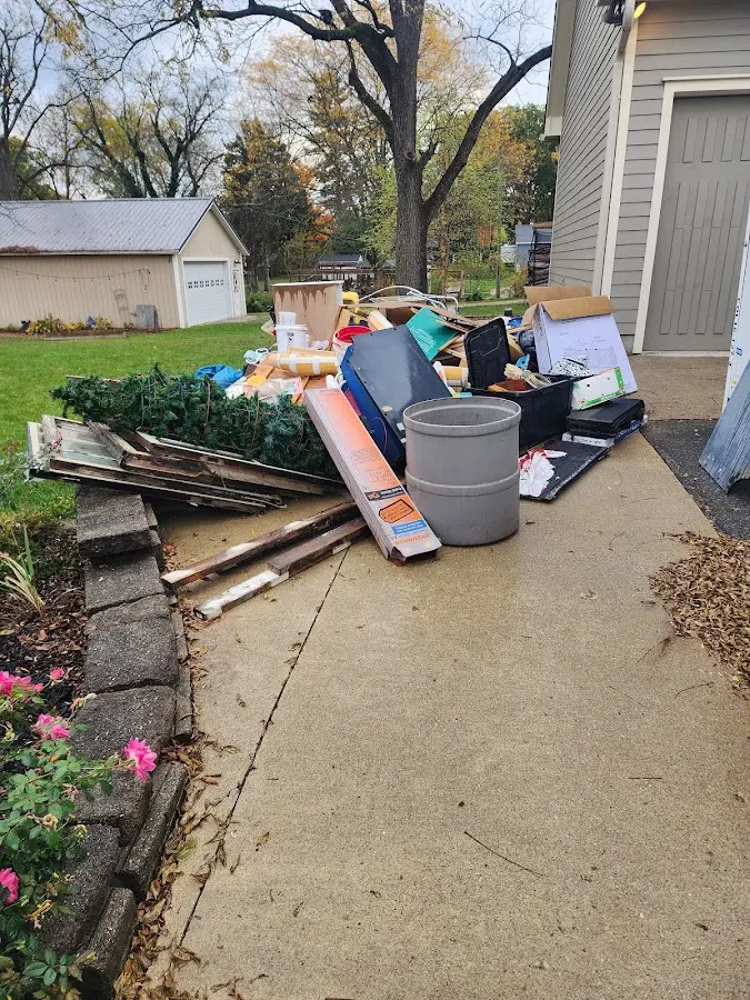 Dumpster being loaded with debris for Residential Dumpster Rental in Phoenix
